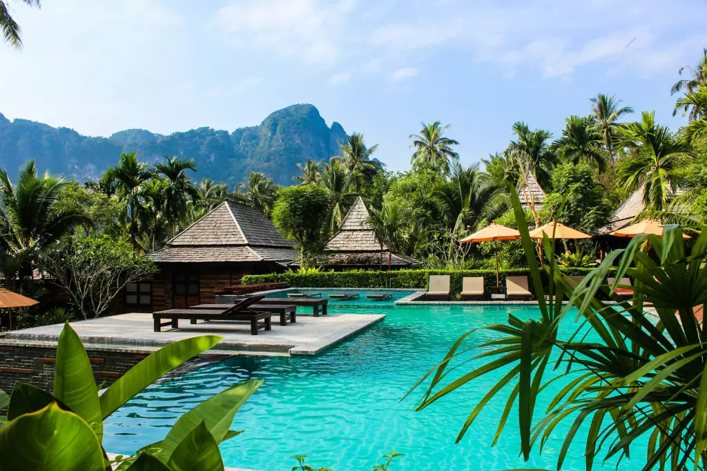 Hotel pool and loungers in soft daylight