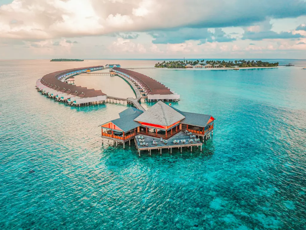 Overwater villas on a turquoise lagoon